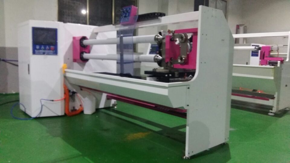 FOUR SHAFT TAPE CUTTING MACHINE FOR VARIOUS ROLL STOCK MATERIAL SUCH AS BOPP MASKING ETC.
